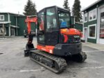 2026 Kubota KX057-5  includes heat, A/C, angle blade, 2X AUX hydraulics, coupler, hydraulic thumb, dig bucket - Image 4