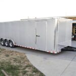 8.5x32 Silver Enclosed Car Hauler Trailer With Ramp and side door (3) 7K Axles 21k GVWR