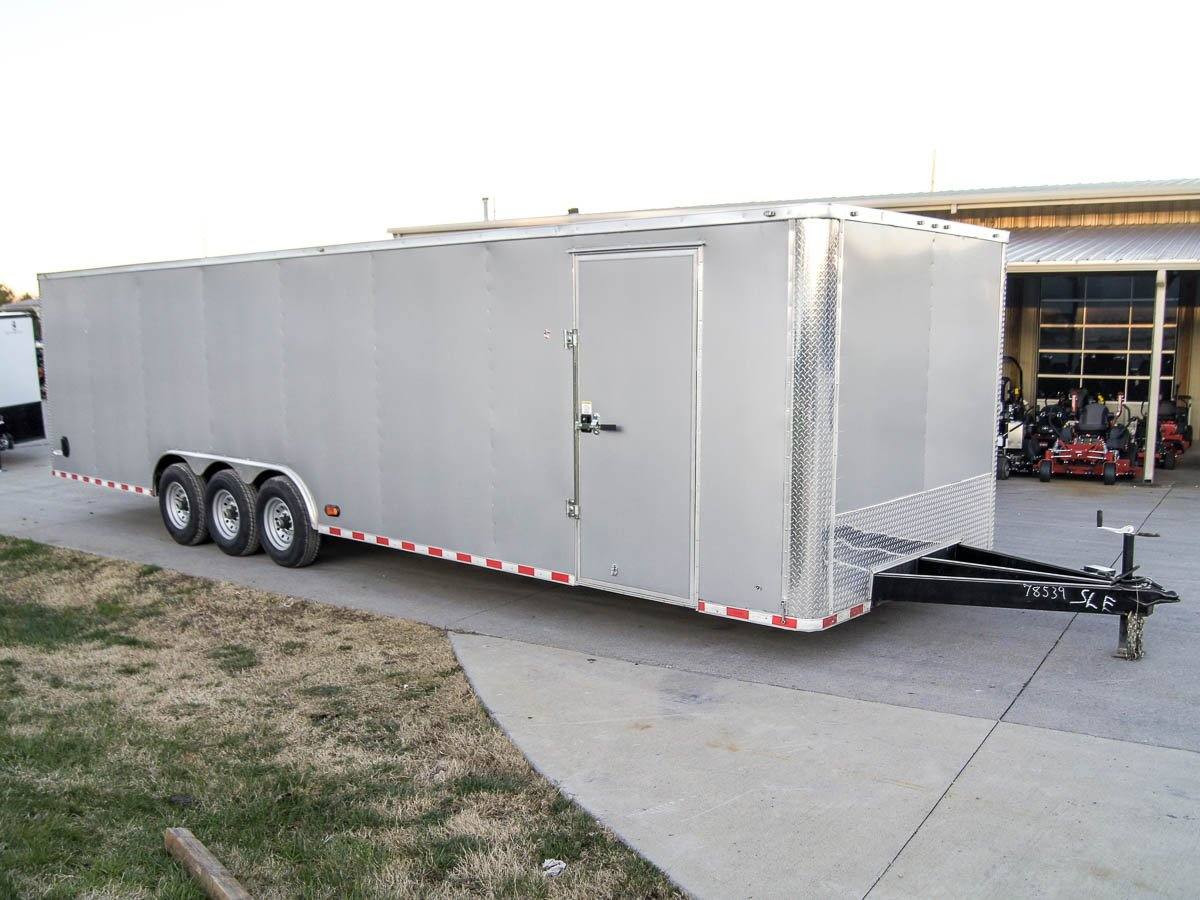 dsc02181_2.jpg 8.5x32 Silver Enclosed Car Hauler Trailer With Ramp and side door (3) 7K Axles 21k GVWR - Image 1